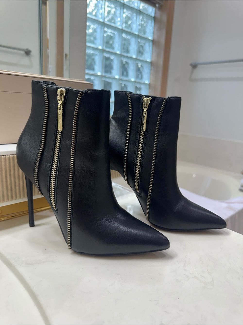 Marciano Black Pointed Stiletto Ankle Boots with Gold Zippers